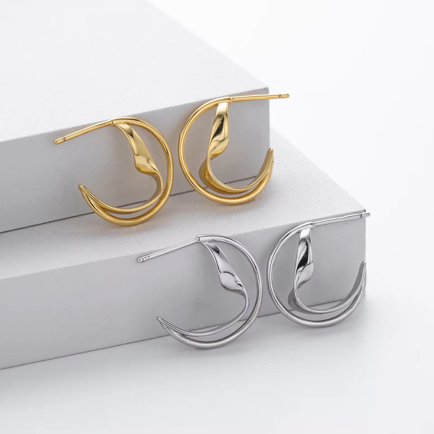 Silver Sculptural Wave Twist Hoops