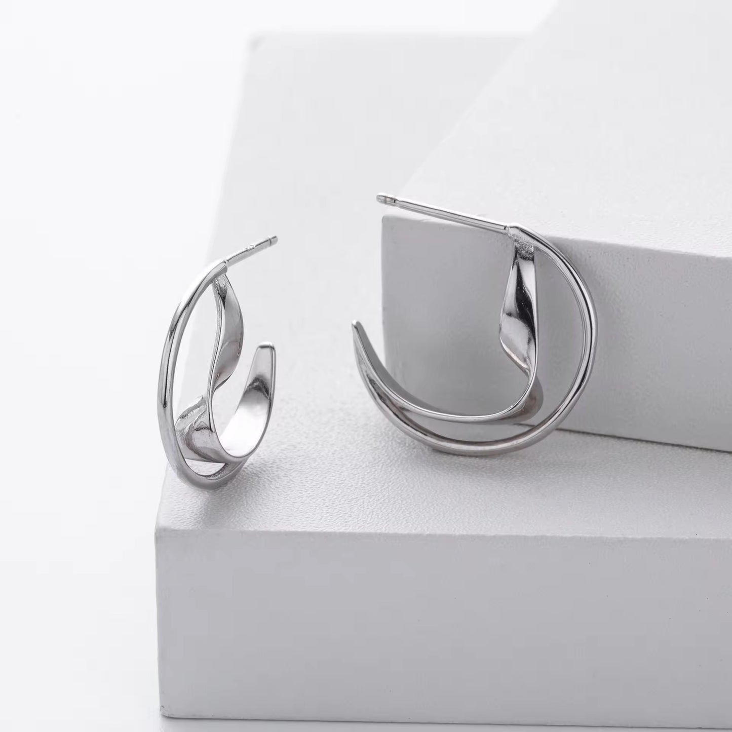 Silver Sculptural Wave Twist Hoops