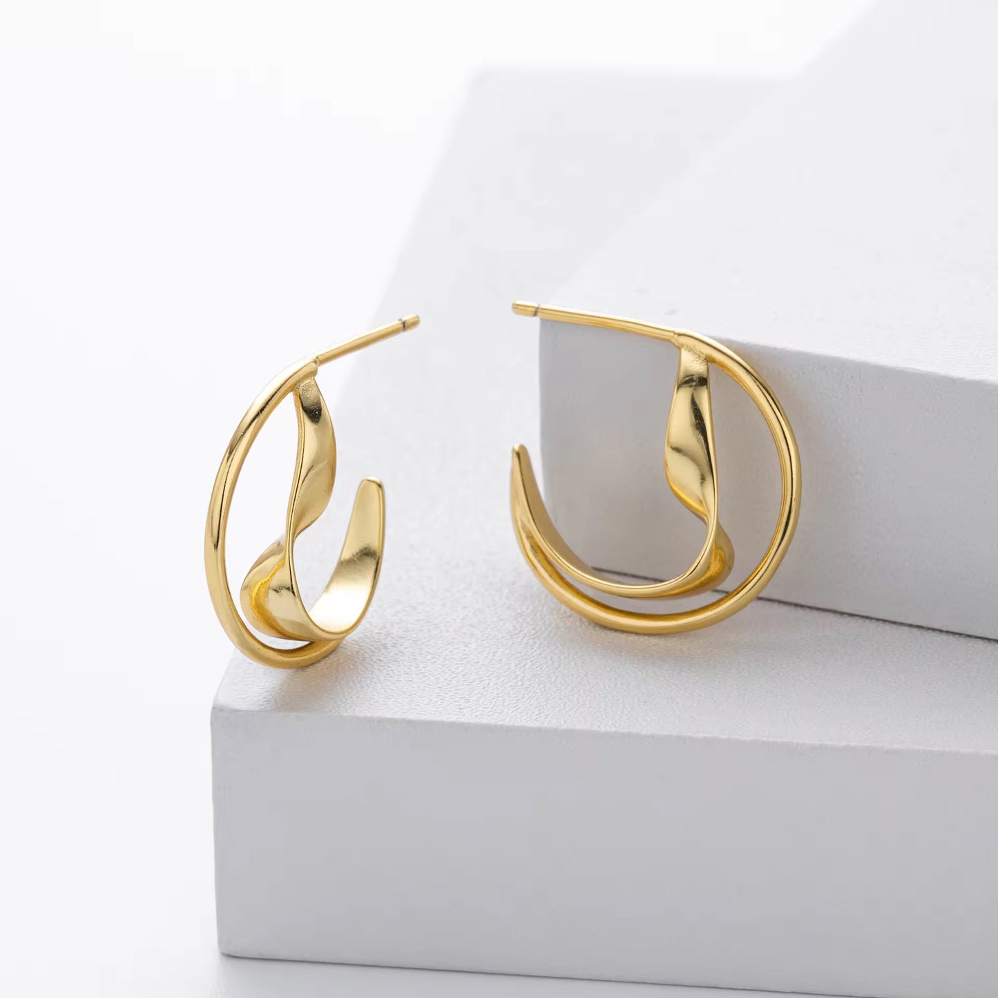 Silver Sculptural Wave Twist Hoops